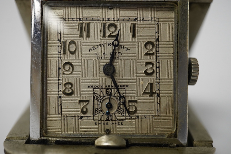 A mid 20th century shagreen mounted base metal travelling timepiece, retailed by The Army & Navy CS Ltd, Bombay, with Roman dial and subsidiary seconds, 37mm. Condition - fair to good